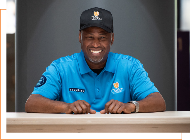 smiling Clarion security guard at front desk
